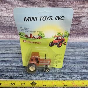 Vintage Mini Toys 1/64 scale Hesston 100-90 die-cast/plastic tractor brown/black